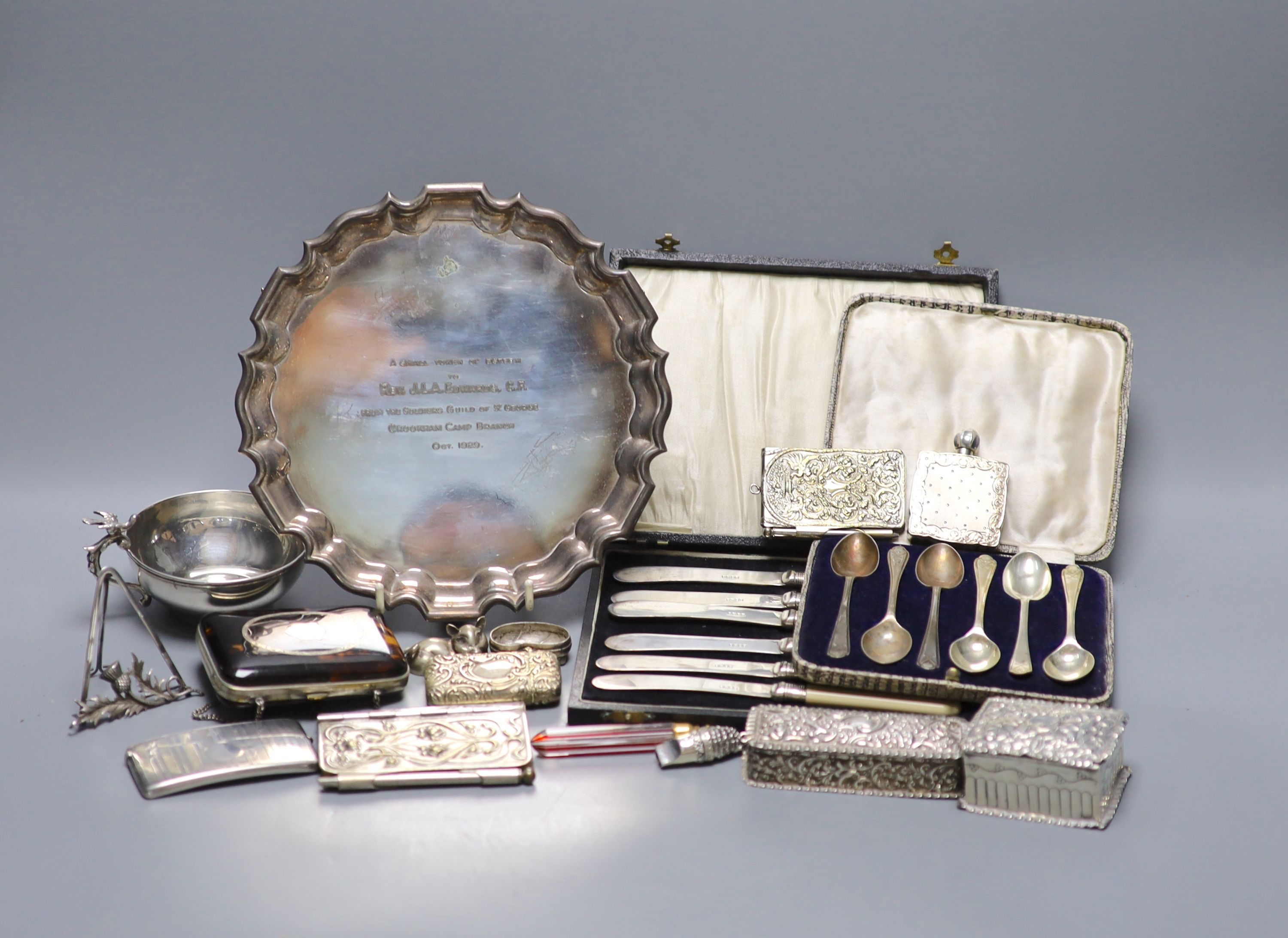 Mixed small silver and plated wares including sterling cup, repousse silver boxes, cased silver teaspoons, silver card case, 925 whistle, plated Art Nouveau aide memoire, plated salver etc.